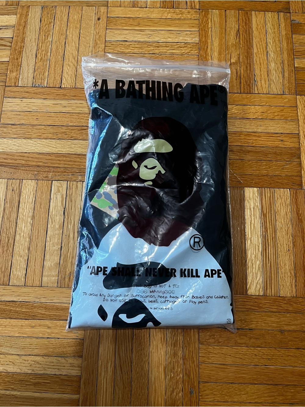 Bape Black White Graphic Tee with Multicolor Camouflage Accent